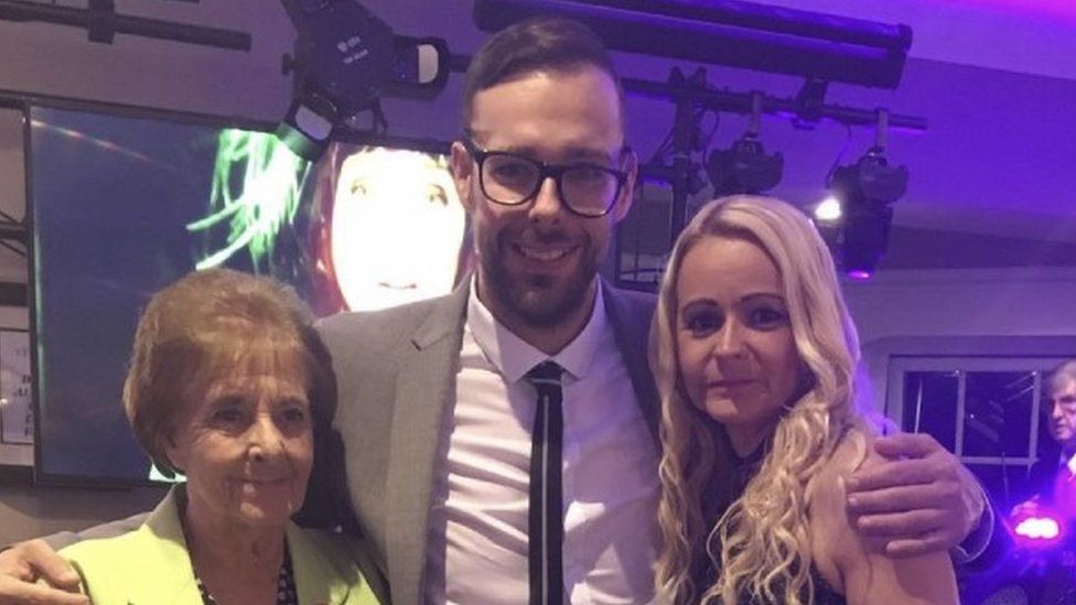 Andrew with his mother and sister