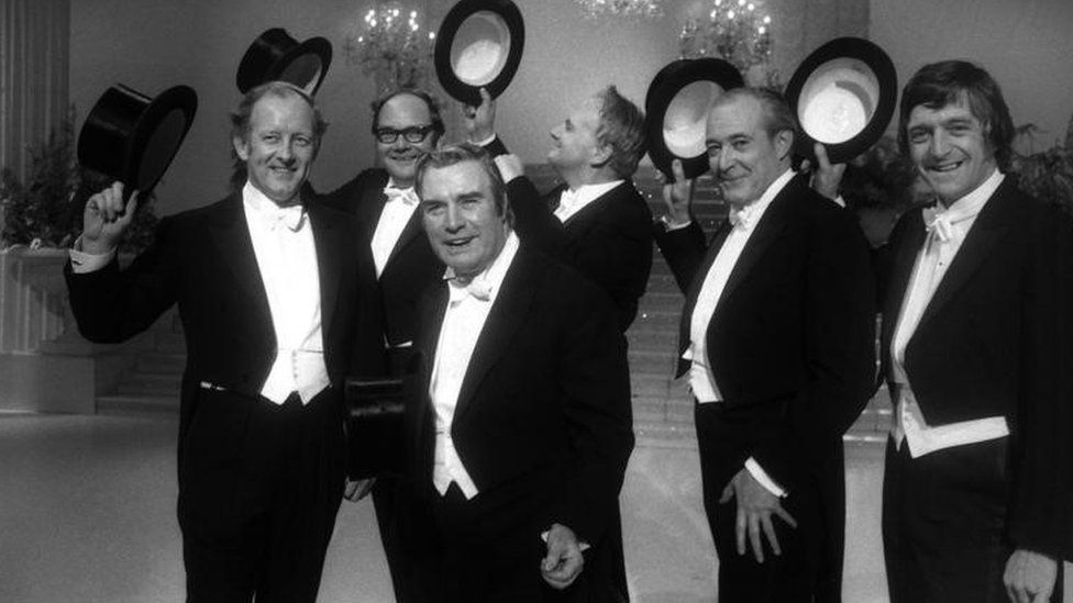 (l-r) Frank Bough, Cliff Michelmore, Eddie Waring, Patrick Moore, Robert Dougall and Michael Parkinson in "The Morecambe and Wise Christmas Show",