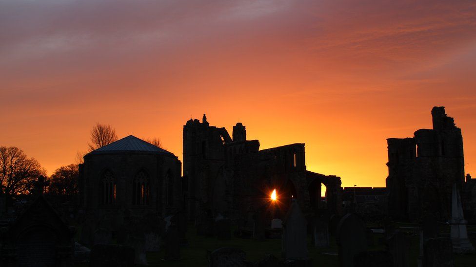 Sun rising over Elgin Cathedral ruins
