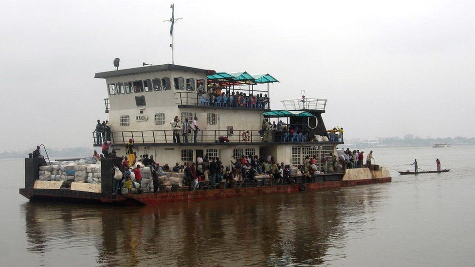 People work on a ferryboat at Brazzaville, linking Congo to the Democratic Republic of Congo