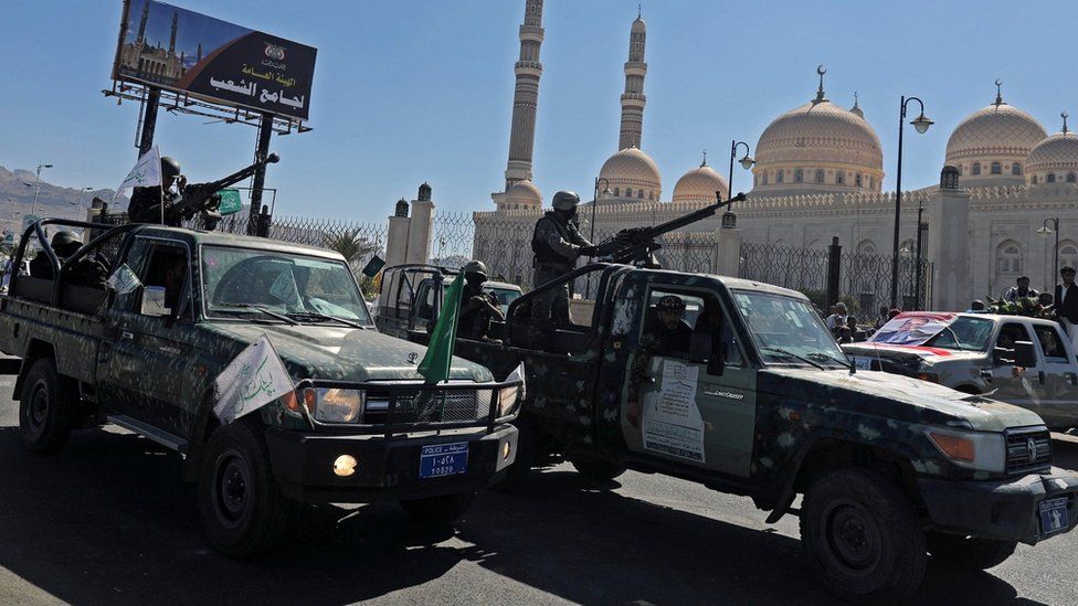 Police patrol trucks during the funeral of Houthi fighters, in Sanaa, Yemen (22 September 2020)
