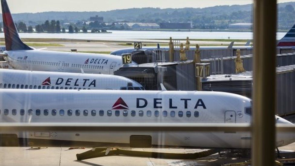 Delta airplanes wait to leave Washington Reagan Airport, in Arlington, Virginia (08 August 2016)