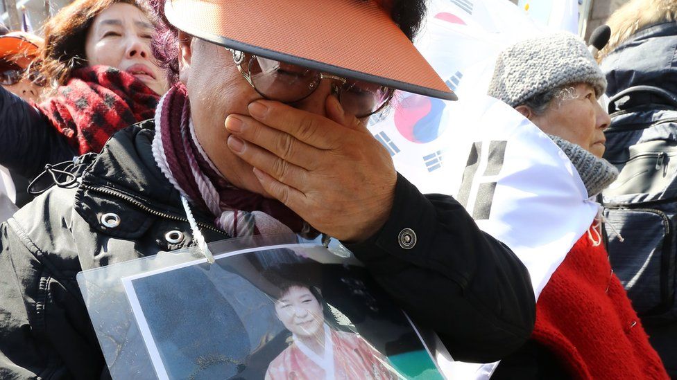 A supporter of impeached South Korean President Park Geun-hye reacts after the ruling by the Constitutional Court in Seoul, 10 March 2017