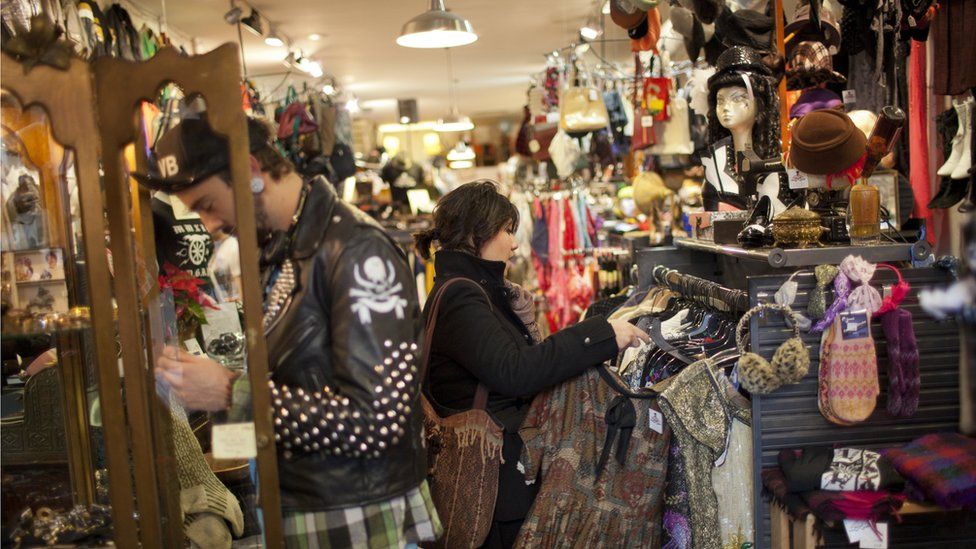 Denise Romero, a 21-year-old Mexican-American, looks for a blouse while shopping January 2, 2012 in a thrift store in Brooklyn, New York.