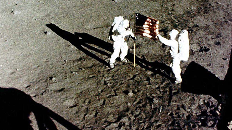 Neil-Armstrong-and-Buzz-Aldrin-raising-the-American-flag-on-the-Moon.