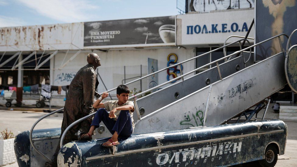 A boy at Hellenikon airport in Athens, where refugees and migrants are being housed temporarily