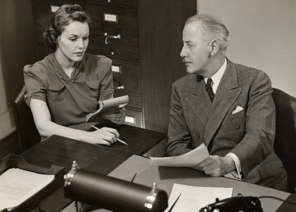 Male executive and female secretary, 1950s