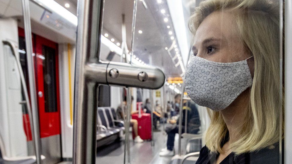 A woman is seen wearing a protective face mask in public transport on September 19, 2020 in Amsterdam