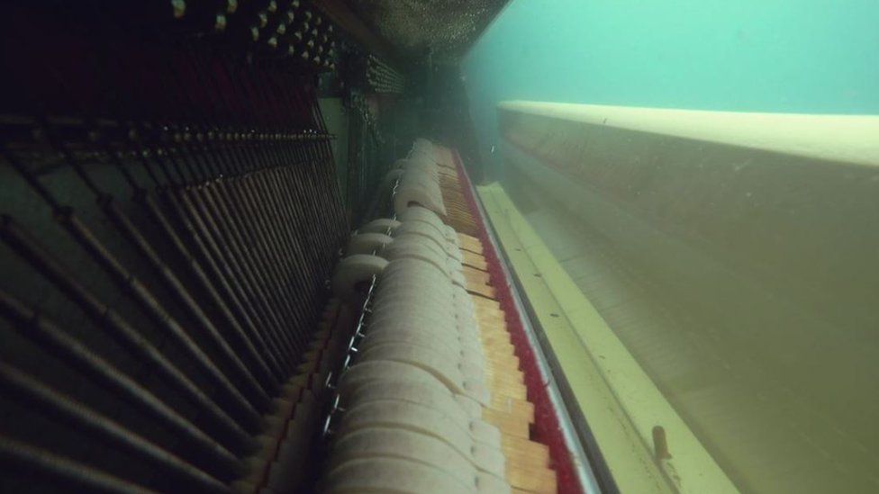 Close up of the piano underwater