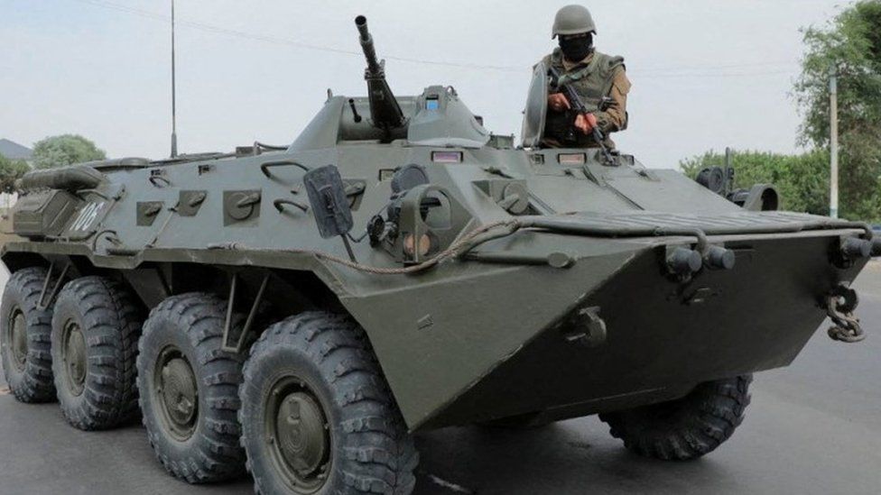 An Uzbek service member guards a street in Nukus, capital of the northwestern Karakalpakstan region, Uzbekistan July 3, 2022.