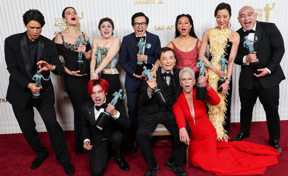Members of the cast of "Everything Everywhere All at Once" Harry Shum Jr., Jenny Slate, Andy Le, Tallie Medel, Ke Huy Quan, James Hong, Stephanie Hsu, Jamie Lee Curtis, Michelle Yeoh and Brian Le, pose with the award for Outstanding Performance by a Cast in a Motion Picture during the 29th Screen Actors Guild Awards at the Fairmont Century Plaza Hotel in Los Angeles, California, U.S., February 26, 2023.