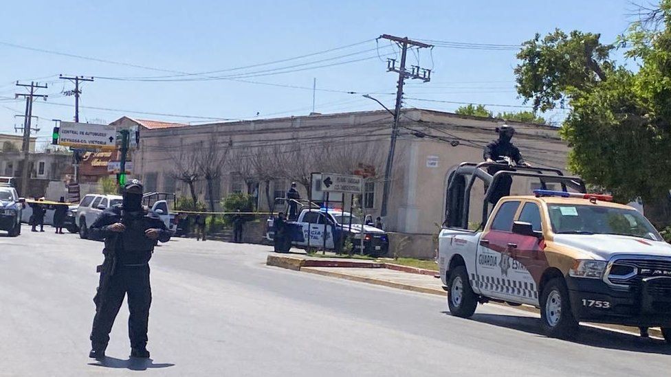 State police officers stand guard near a crime scene in Matamoros, Mexico