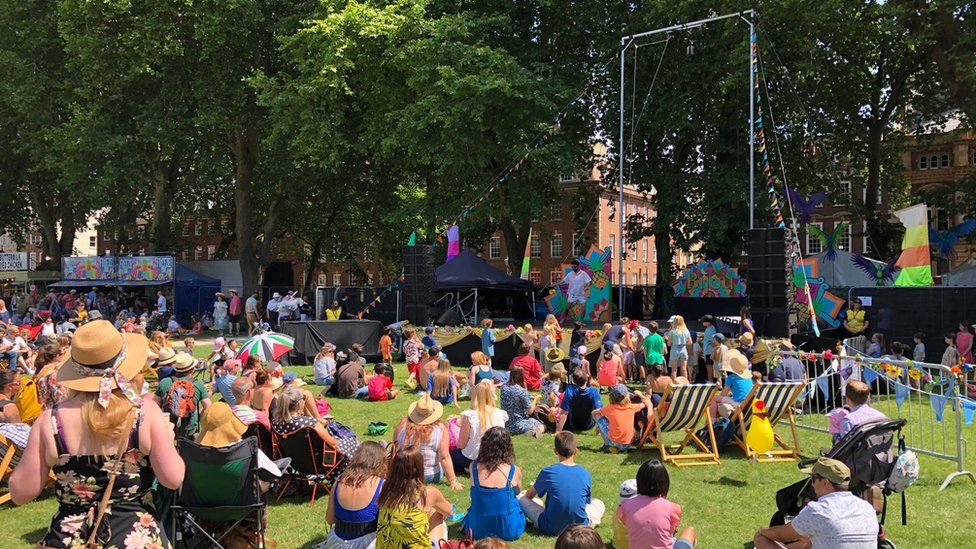 Families sittingwatching a performance