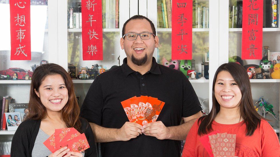 Lok Man Fan poses with her husband and sister