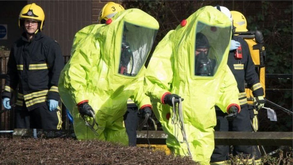 Specialist officers in protective suits