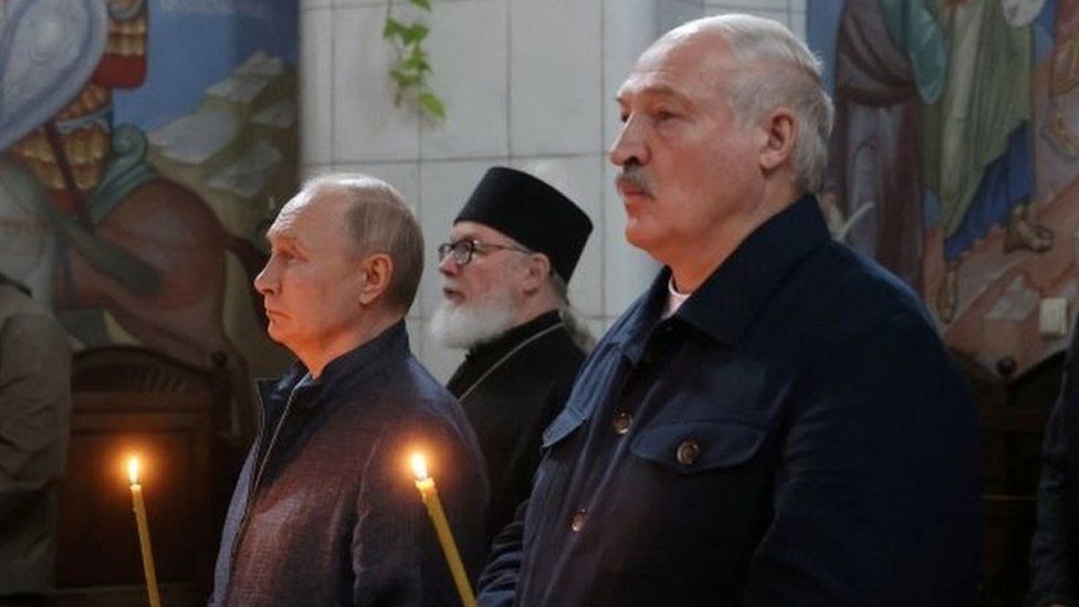 Russian President Vladimir Putin (L) and Alexander Lukashenko (R) at a church service in Karelia, Russia, in July