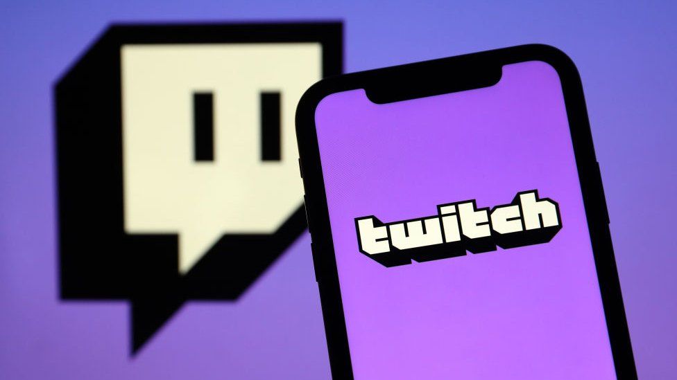 An image of a phone displaying the Twitch logo