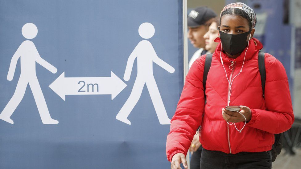 Woman wearing face mask in Leeds