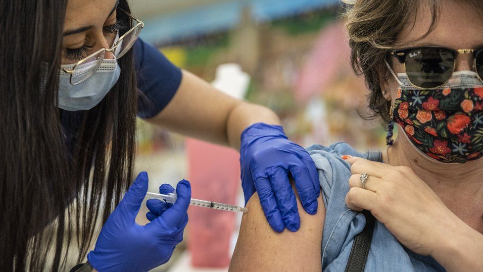 A woman receives a vaccine at a vaccination site at a senior center on March 29, 2021 in San Antonio, Texas