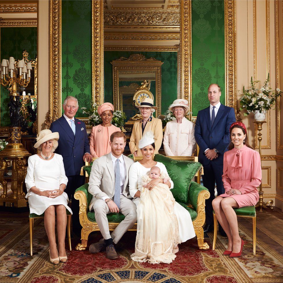 The Duke and Duchess of Sussex with their son, Archie and (left to right) the Duchess of Cornwall, The Prince of Wales, Doria Ragland, Lady Jane Fellowes, Lady Sarah McCorquodale, the Duke of Cambridge and the Duchess of Cambridge in the Green Drawing Room at Windsor Castle following Archie's christening.