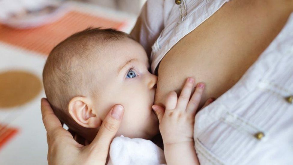 A baby being breastfed