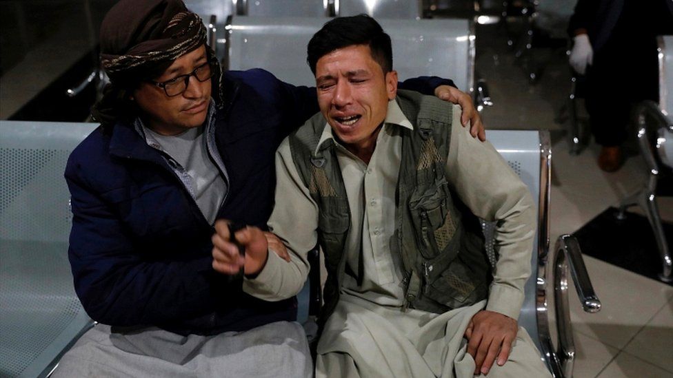 An Afghan man who lost his brother mourns at a hospital after a suicide bombing in Kabul, Afghanistan, 24 October 2020
