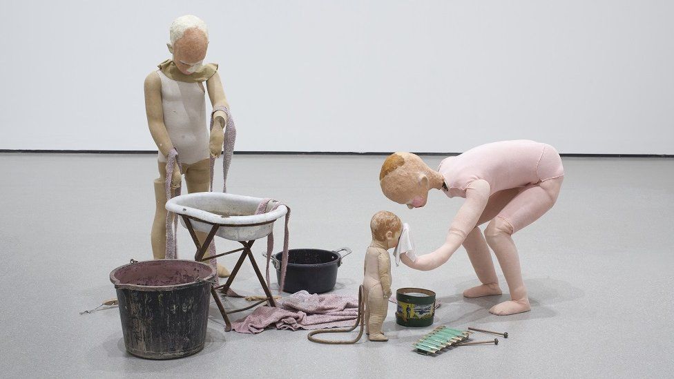 some human sculptures in an art exhibition