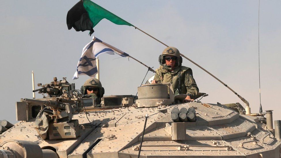 A 'Merkava' battle tank carrying Israeli soldiers at an area along the border with Gaza, southern Israel, 13 October 2023