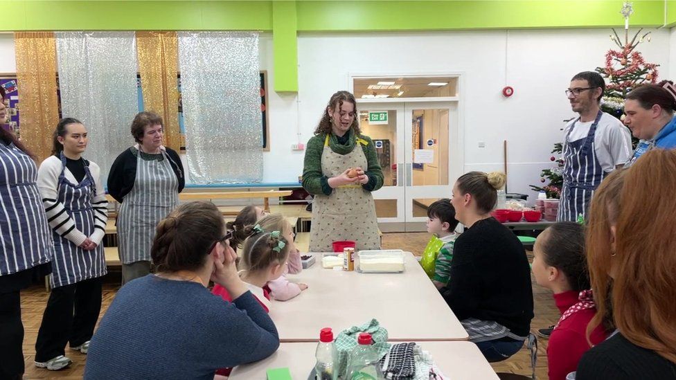 Susanna Iqbal talks to parents and children at Flourishing Families' cookery club