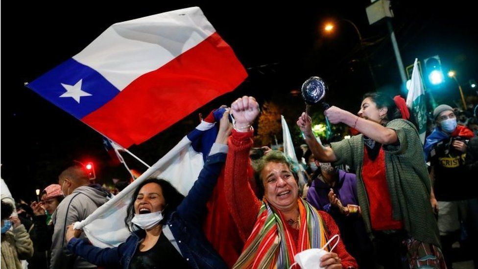 Supporters of the "I Approve" option react after hearing the results of the referendum on a new Chilean constitution in Valparaiso, Chile, October 25, 2020.
