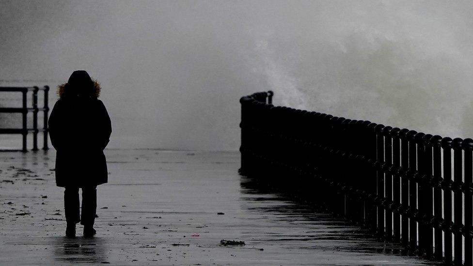 Waves crash over the promenade during rain and strong winds in Folkestone, Kent