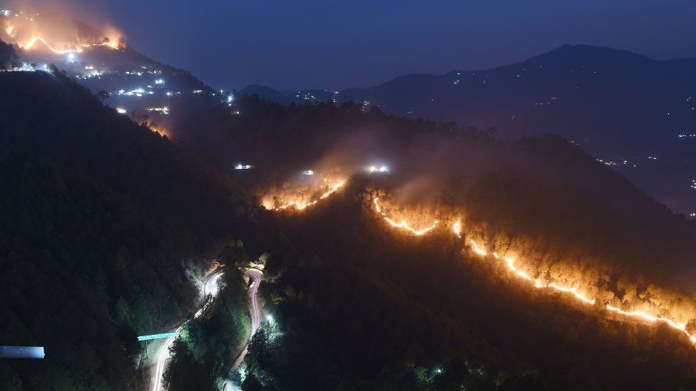 fires burn in hills around New Tehri at Bourari in the Indian state of Uttarakhand on May 24, 2018