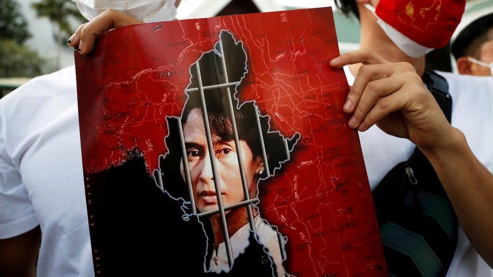 Picture of Aung San Suu Kyi's face behind bars
