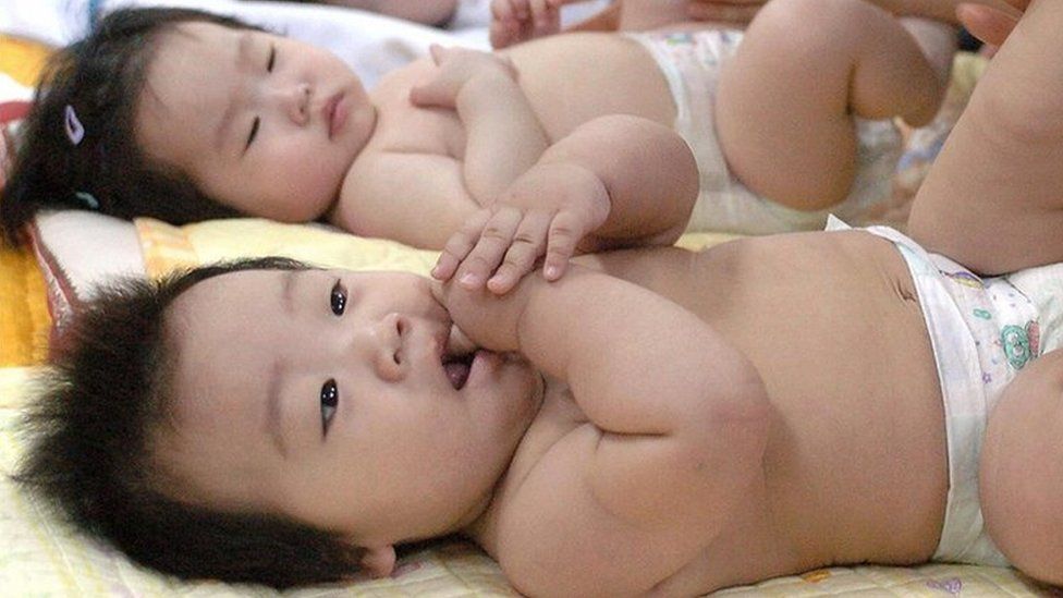 S Korean mothers massage babies