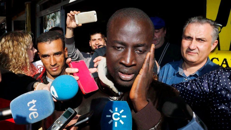 Senegalese man reacts after discovering that he has one ticket of the number 79,140, the first prize of El Gordo Christmas lottery, in Roquetas de Mar, Andalusia, southern Spain, 22 December 2015.