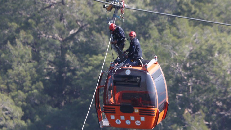 The accident happened early on Friday evening, when a pod hit a pole bursting open and sending passengers plummeting to the rocky mountain-side