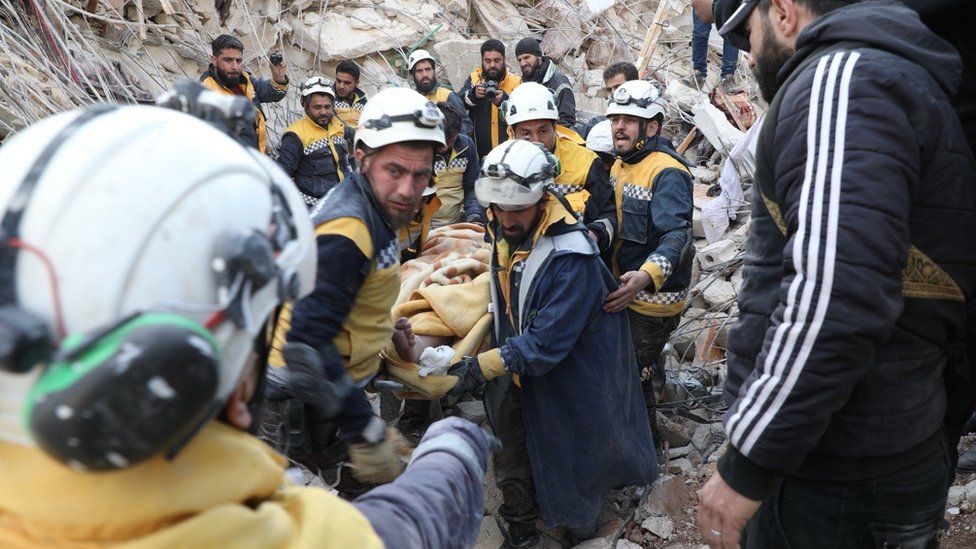 White Helmets rescue teams extracting a casualty from rubble in northern Syria