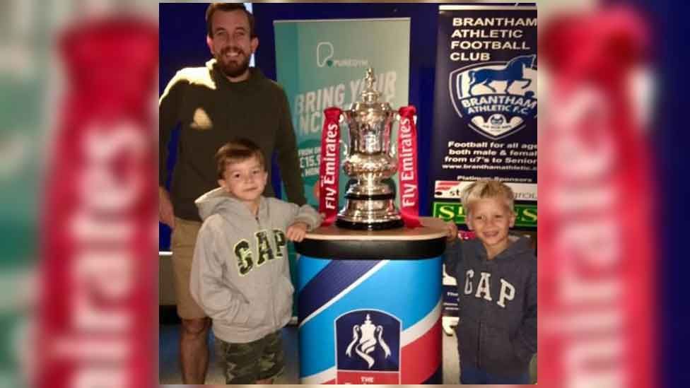 Dan Humphries with sons Liam and George and the FA Cup