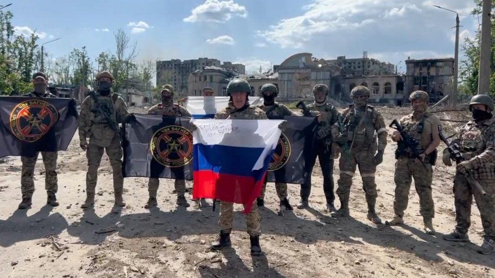 Yevgeny Prigozhin makes a statement as he stand next to Wagner fighters in the course of Russia-Ukraine conflict in Bakhmut, Ukraine, in this still image taken from video released May 20, 2023