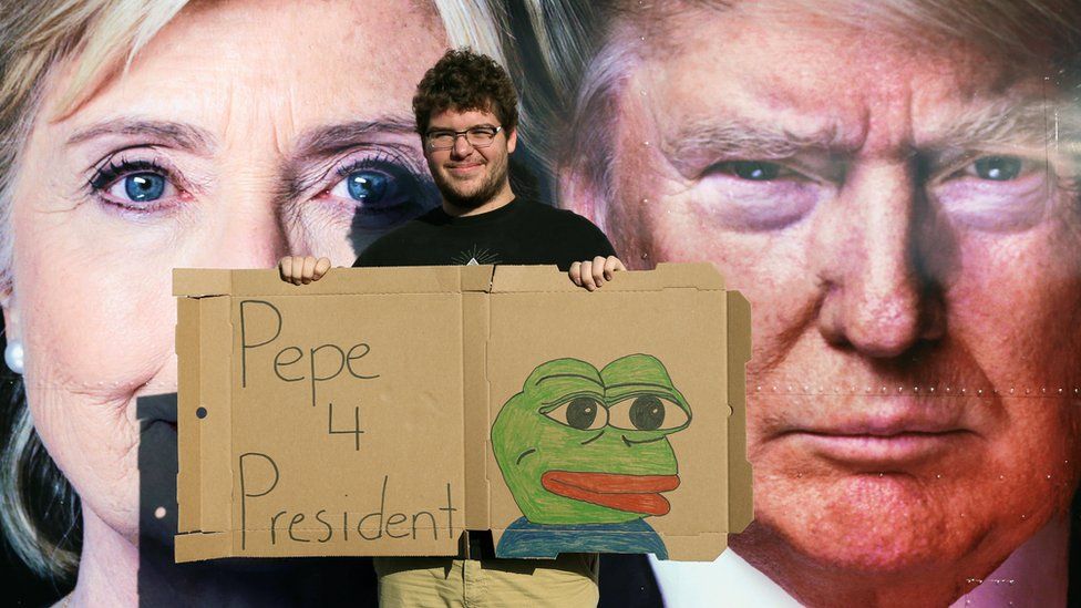 Man with Pepe the Frog sign
