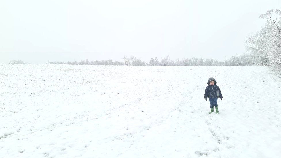Child walking in thick snow