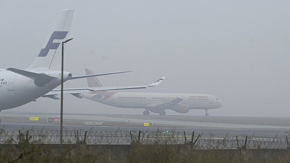 Passengers aircrafts ready to takeoff in morning heavy fog at Terminal 3 airport on 3 January in New Delhi, India