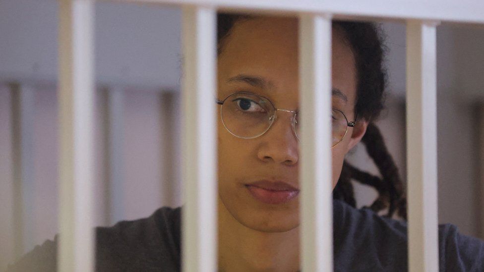 U.S. basketball player Brittney Griner stands inside a defendants' cage in August 2022