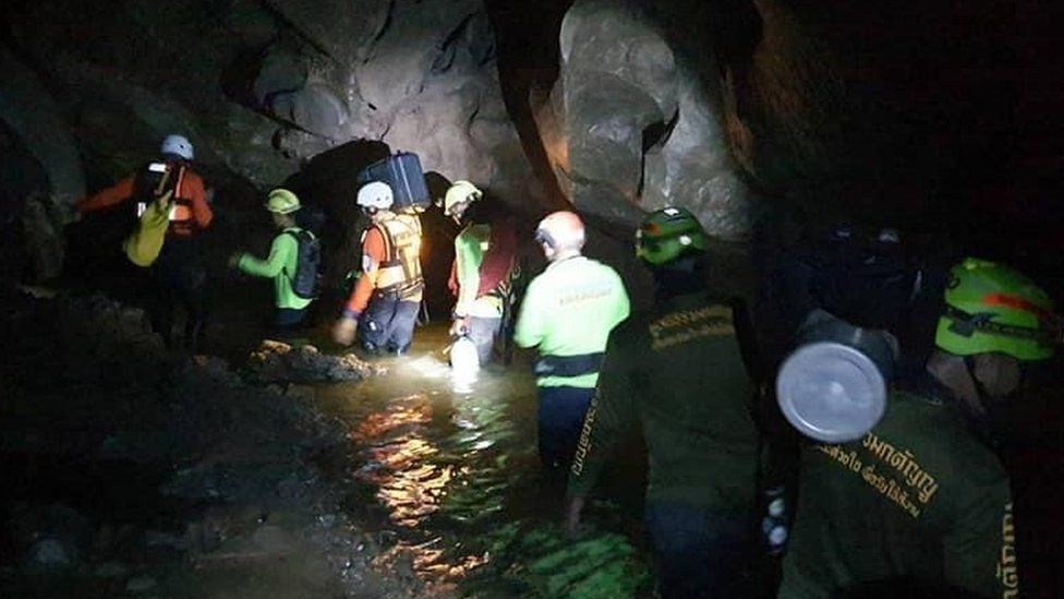 Divers walking in the cave