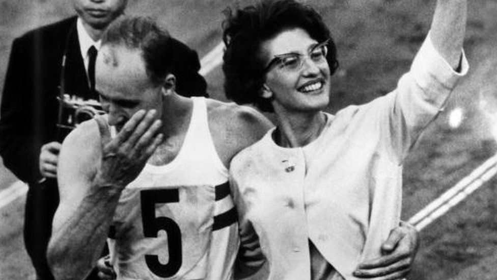 16th December 1964: Ken Matthews is supported by his wife Sheila after winning the 20 kilometre walk at the Tokyo Olympic Games