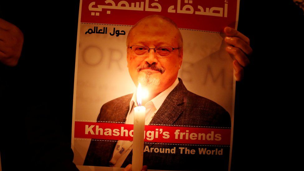A demonstrator holds a poster with a picture of Saudi journalist Jamal Khashoggi outside the Saudi Arabia consulate in Istanbul, Turkey October 25, 2018.