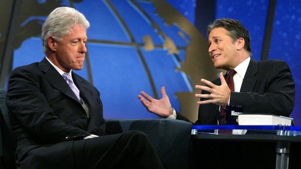 Former US President Bill Clinton speaks with host Jon Stewart on Comedy Central's "The Daily Show" August 9, 2004