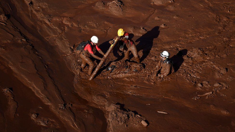 Firefighters search for bodies two days after the collapse of a dam near the town of Brumadinho on 27 January