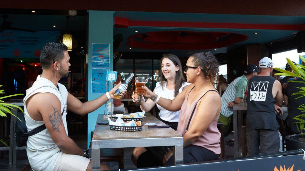 A group of drinkers at a pub in Darwin