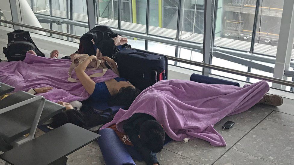 People resting in Terminal 5 at Heathrow airport
